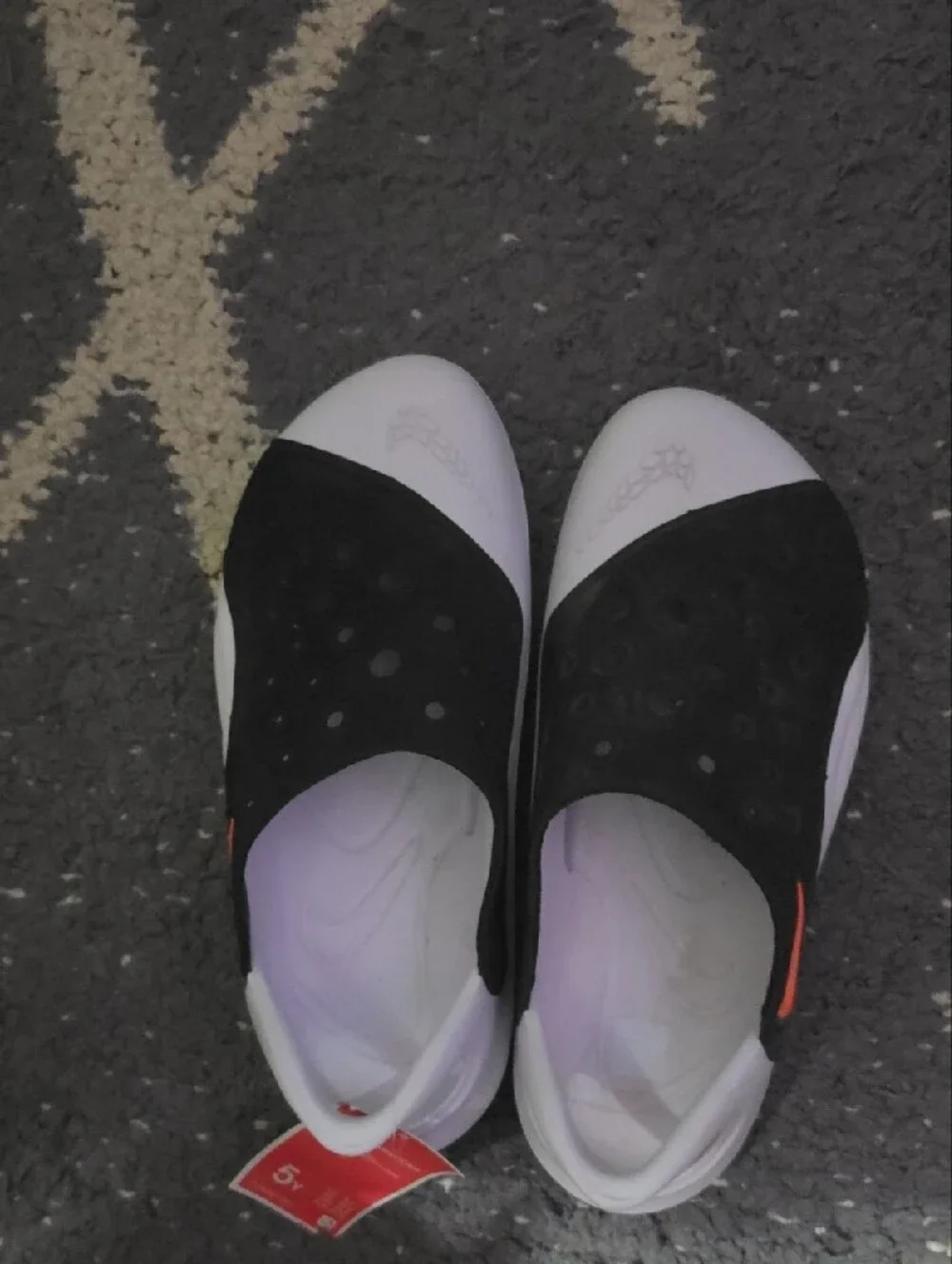 Nike Kids Black and White Slip-On Sandals with Perforated Upper